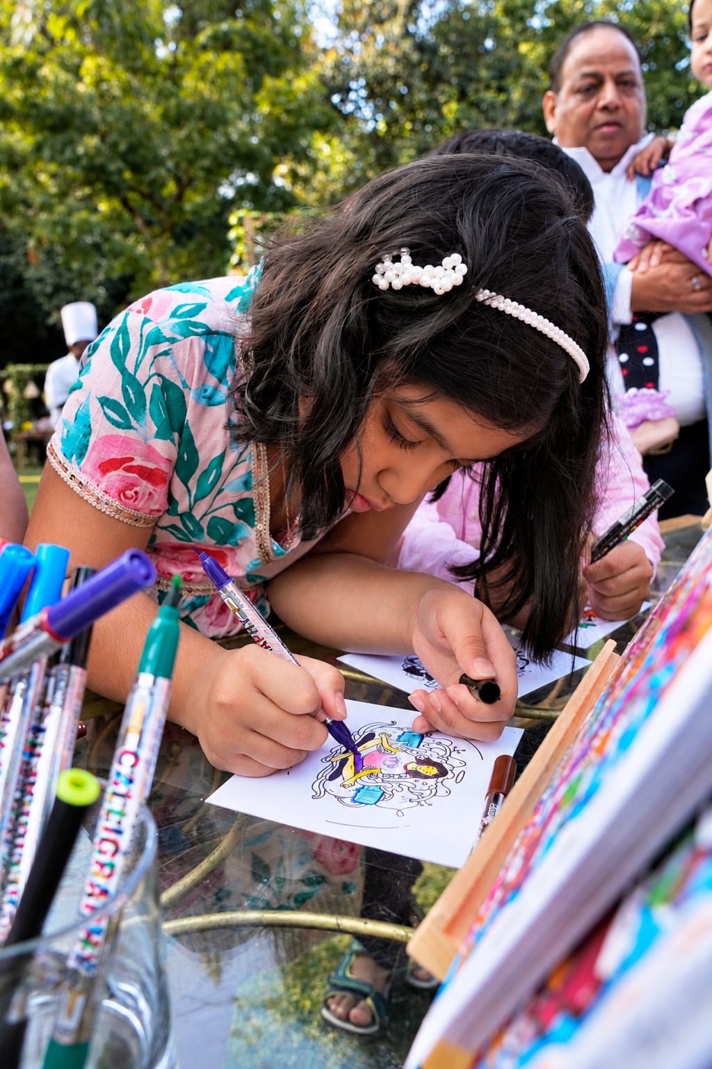 Child holding her doodle at a workshop